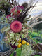 Join Flower Farmer and Florist Georgie Newbery as she shows you how to make a fabulous autumn wreath out of entirely foraged materials from her gardens at Common Farm in Somerset. Using twigs and berries, seed heads, foliage, and dried flowers, she’ll show you how to twist together a rustic circle of twigs, and how to create a garland of goodies with which to dress it.